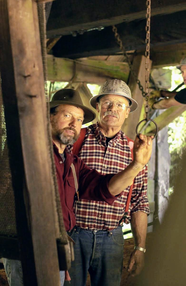 Harvey Henningsen and Bob Sturgeon working in the mill